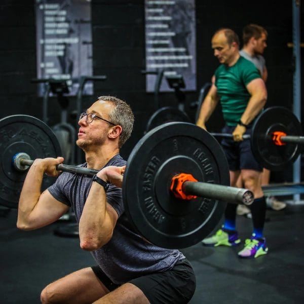 Man powerlifting at Esprit De Corps CrossFit