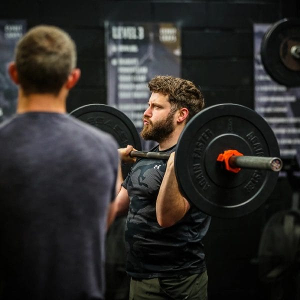 Man doing weight lifting at Esprit De Corps CrossFit